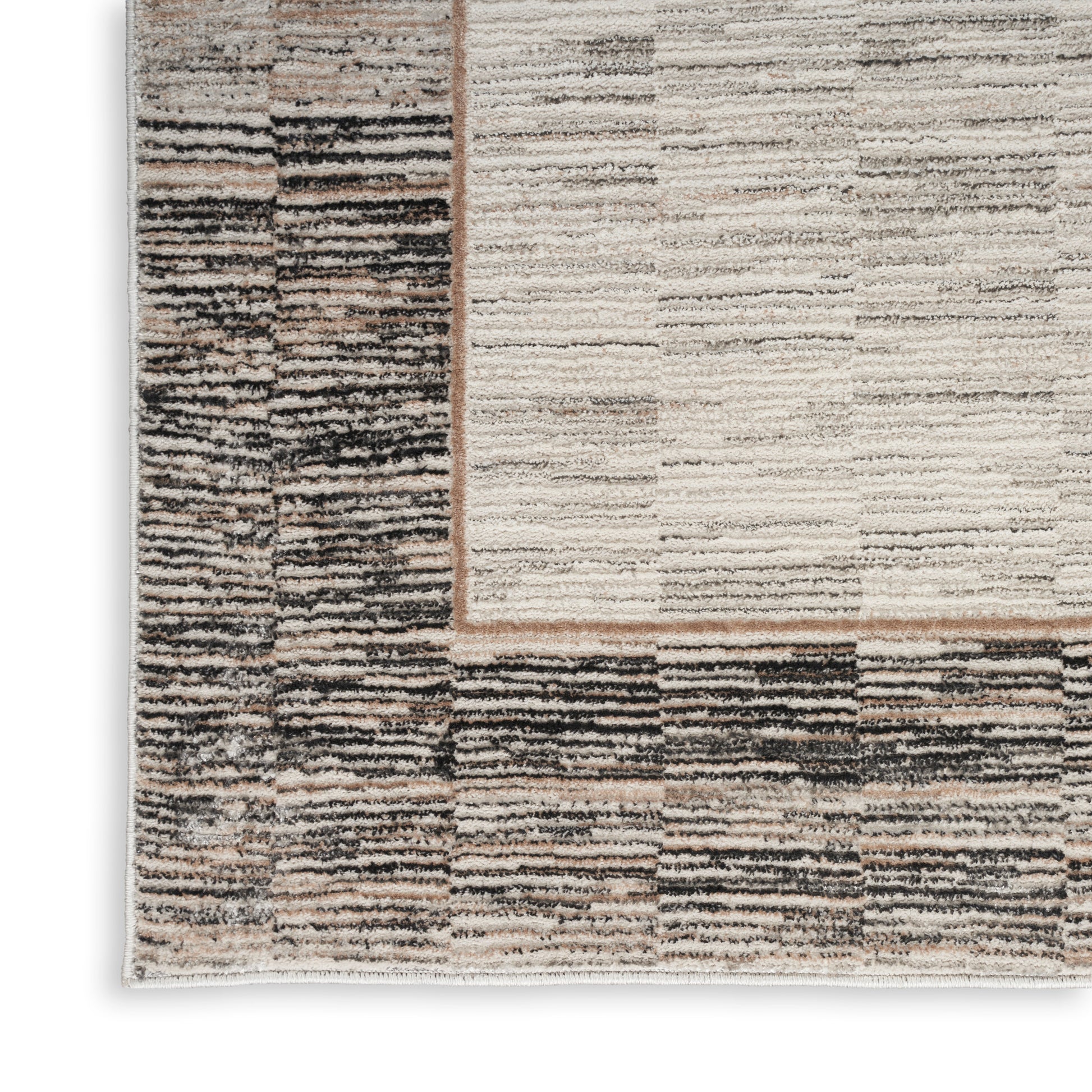 Neutral abstract area rug with cream, beige, taupe & charcoal stripes; textured pile & dark border.