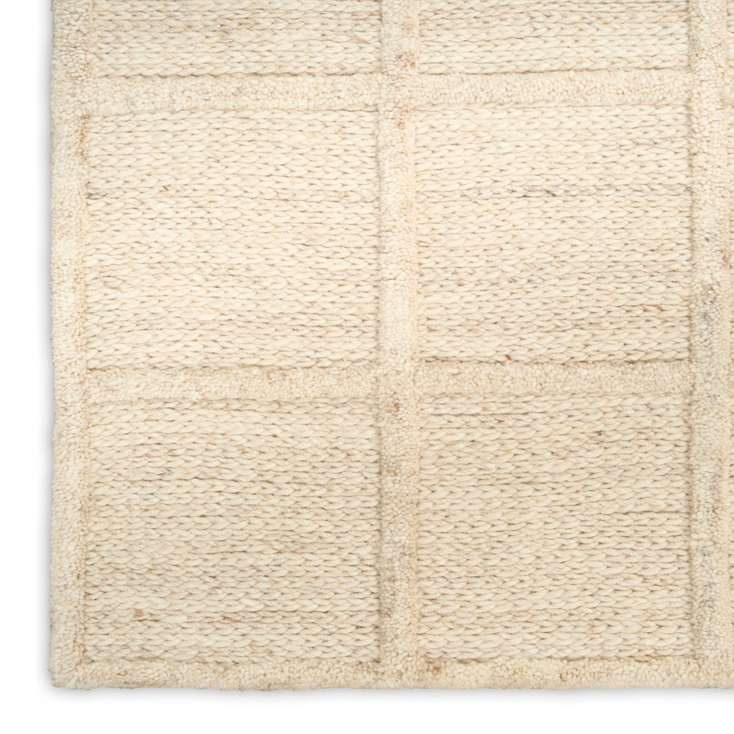Beige woven bath mat with square grid panels in soft loop pile.