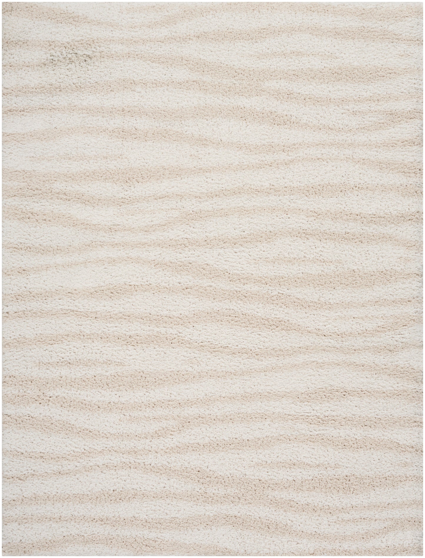 Cream beige shag rug with plush pile and subtle wavy texture.