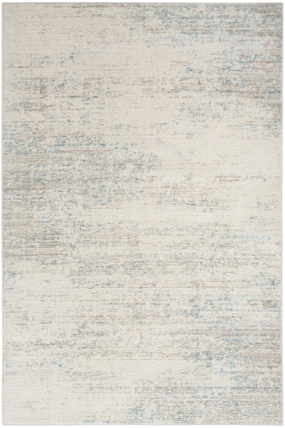 Light beige rug with pale blue-gray distressed wash, modern abstract pattern; versatile for living room or bedroom.