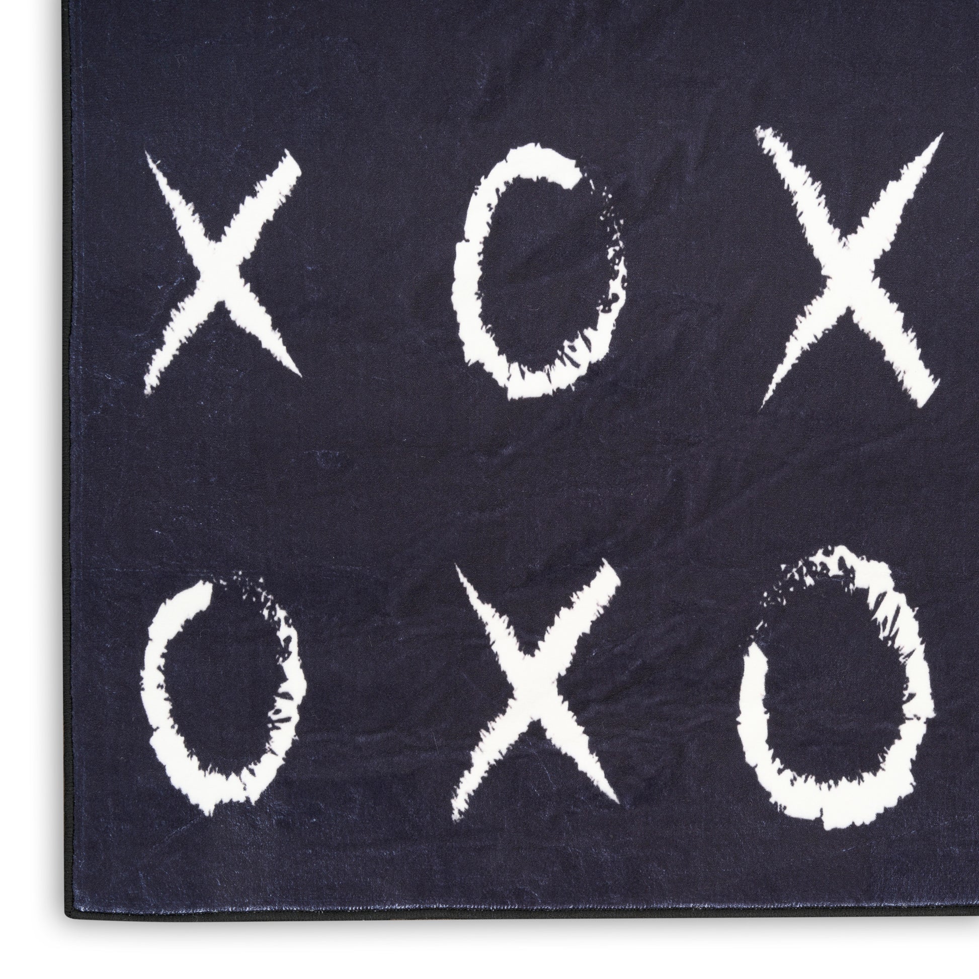Dark navy rug with a chalky white X and O tic-tac-toe grid, textured surface, playful modern design.