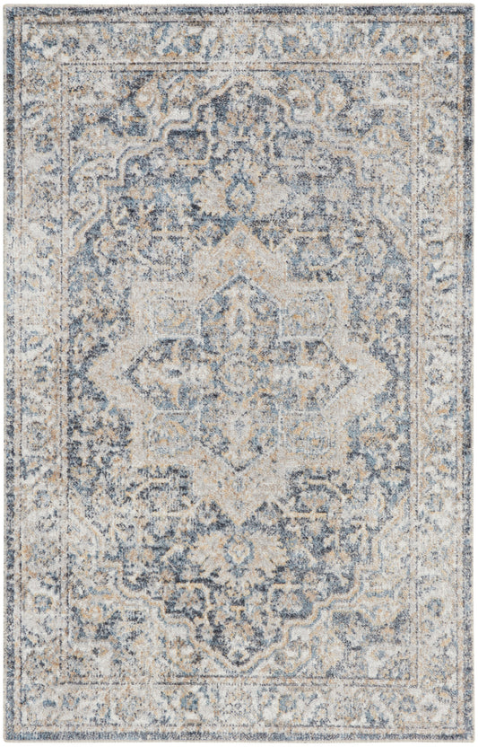 Rectangular blue-gray and ivory distressed oriental rug with a central medallion and ornate border.