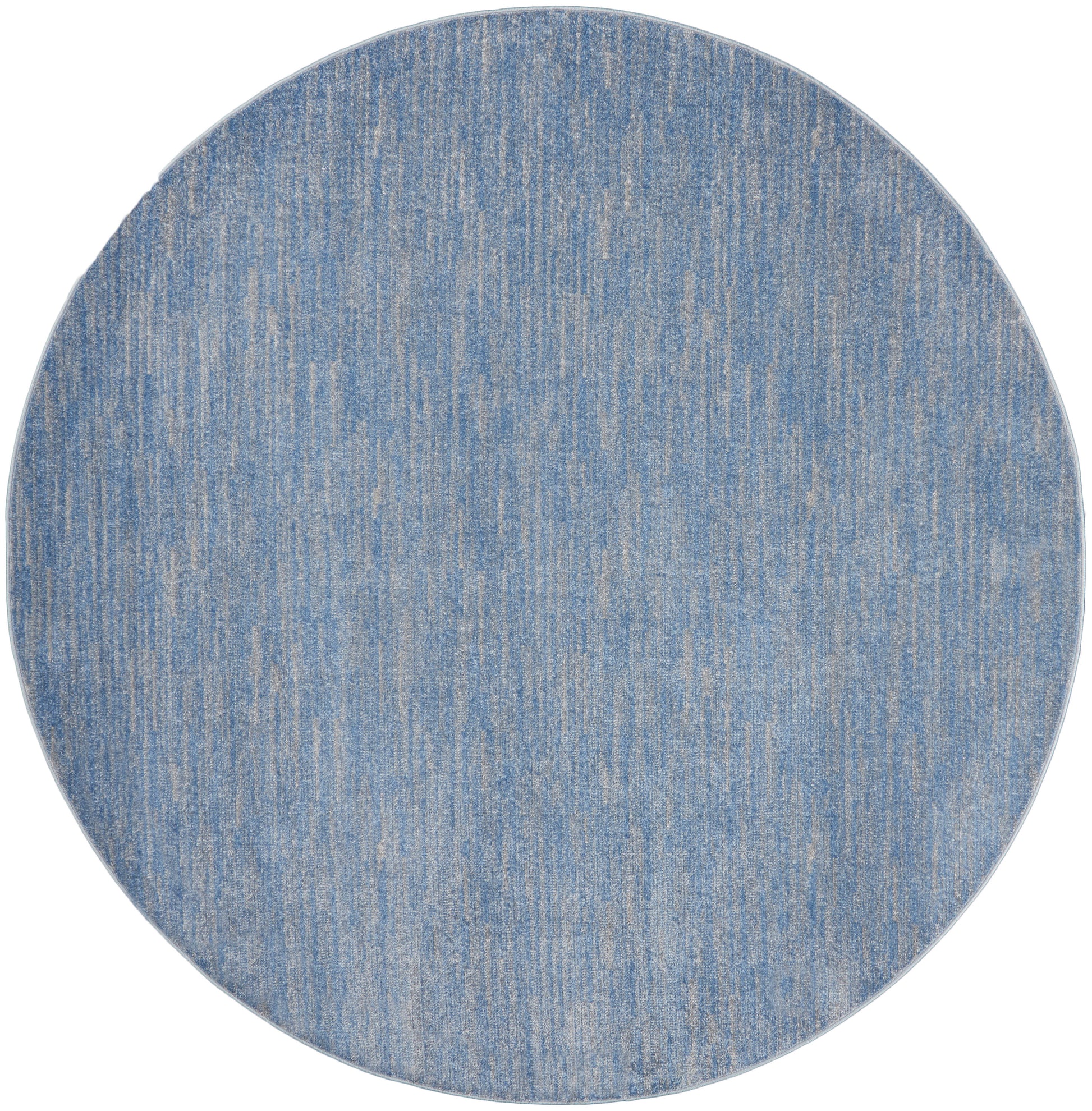 Round blue denim-style rug with a subtle lighter streaked texture.