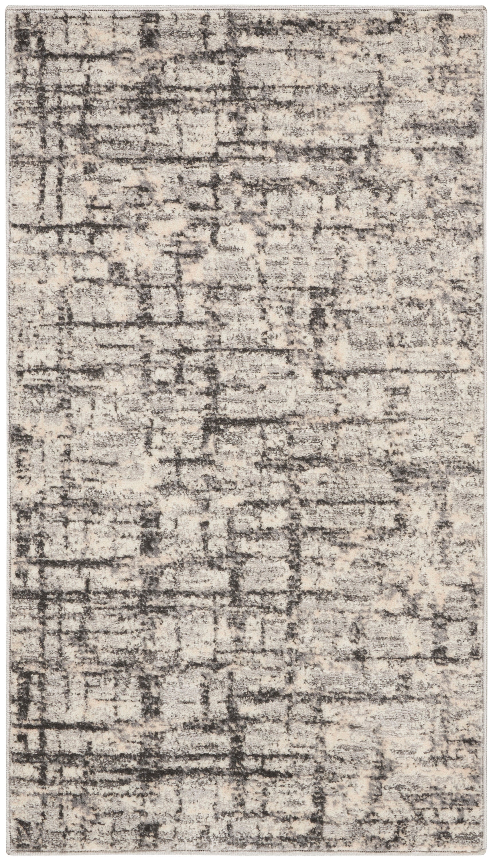 Rectangular abstract distressed rug in beige and charcoal gray with muted texture for modern neutral decor.