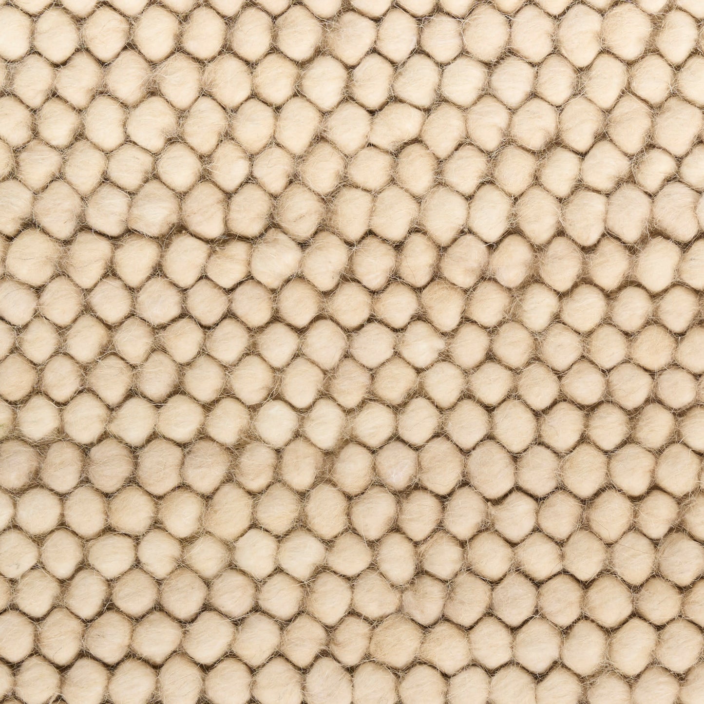 Beige bubble-textured rug with tiny round padded bumps; soft, plush surface; 10' x 14