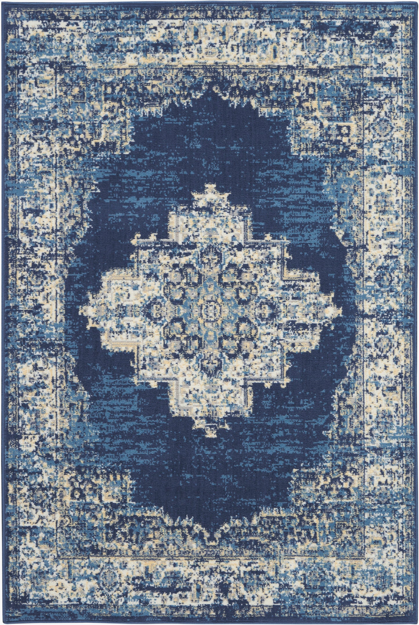 Distressed navy blue area rug with ivory and light blue accents, features a central geometric medallion and ornate border.