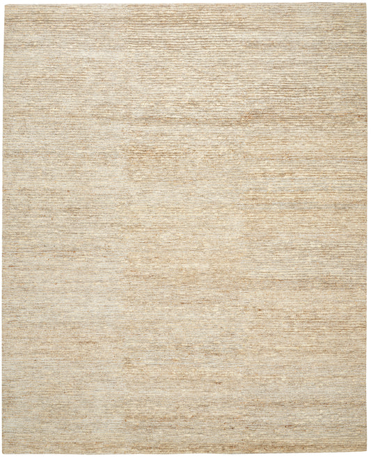 Beige textured area rug with subtle woven pattern in warm sandy tones.