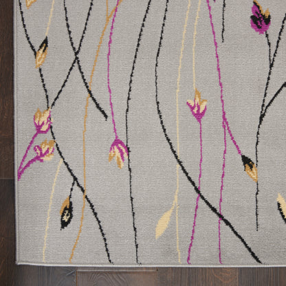 Gray woven runner rug with abstract black, pink & yellow vine lines and small floral accents; modern botanical pattern.