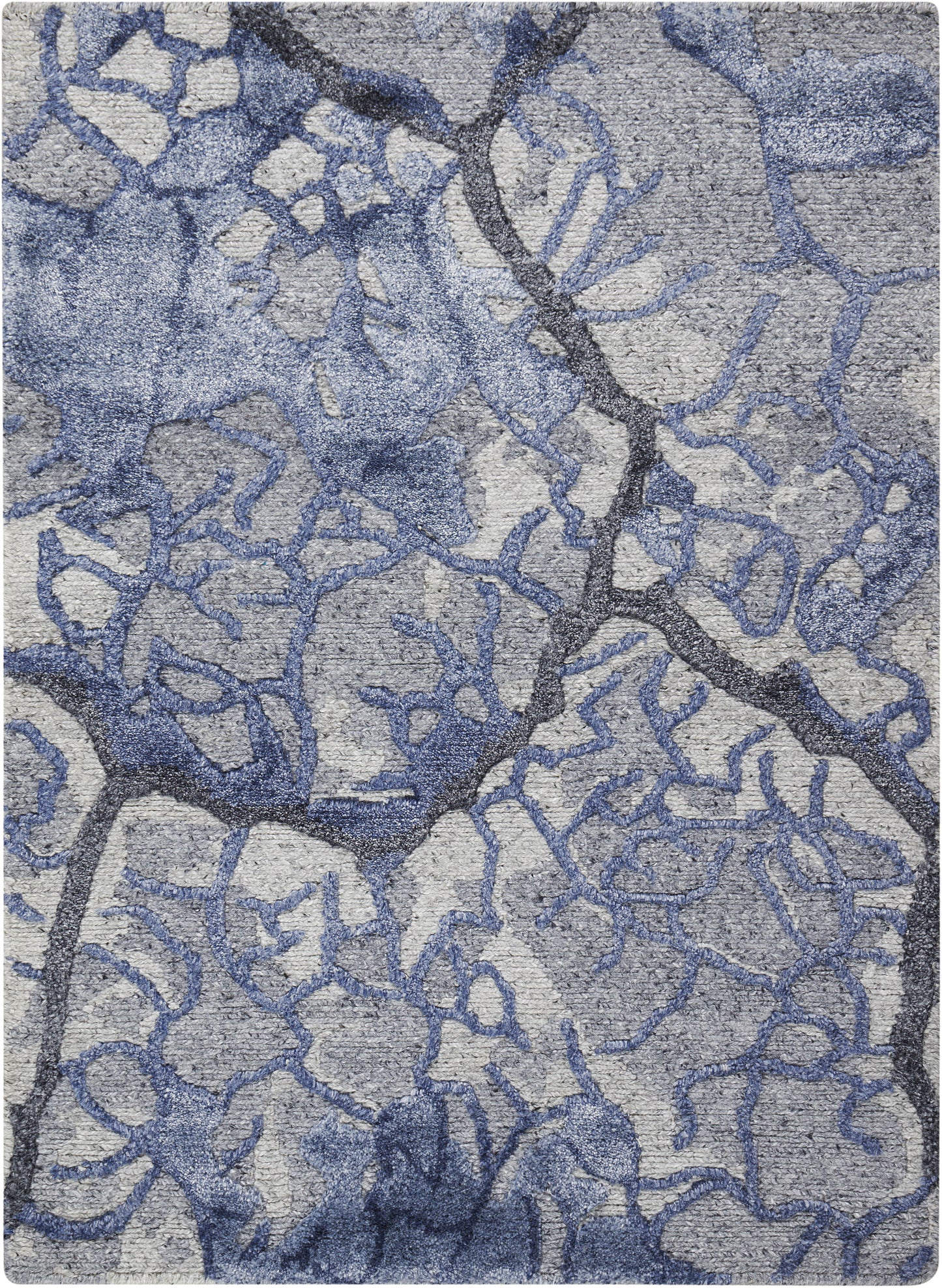 Blue-gray abstract rug with irregular branching lattice pattern and soft woven texture.