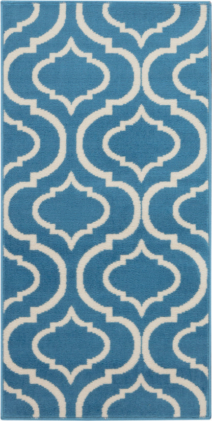 Blue rug with a white Moroccan trellis pattern, plush pile, rectangular 2' x 4' rug.