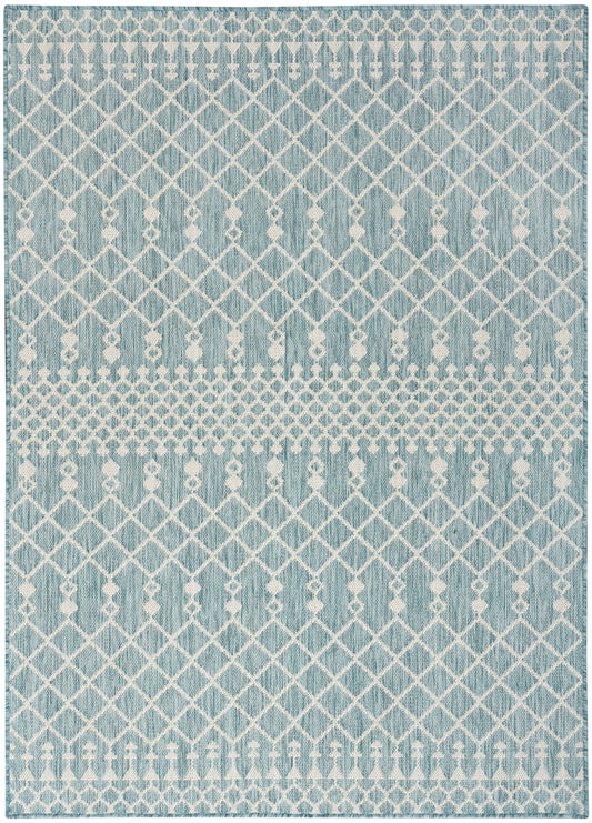 Blue woven rug with white diamond lattice and dotted bands; rectangular living room rug.