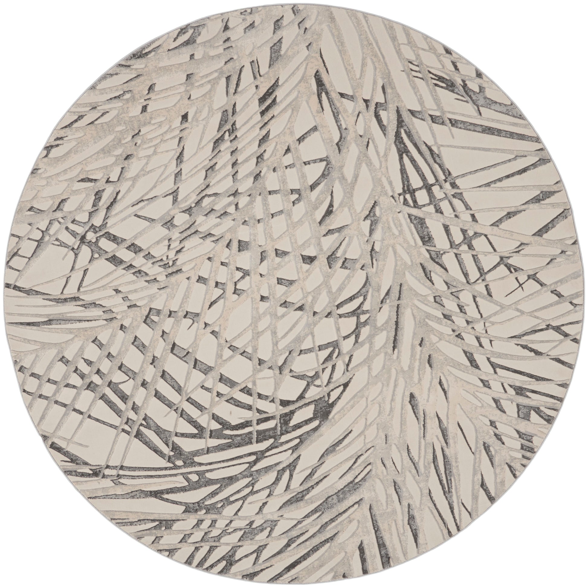 Round beige rug with charcoal abstract linear scribble pattern; modern decor.