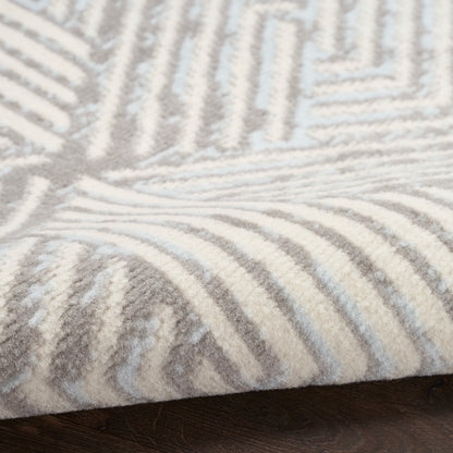 Soft beige and ivory striped rug with plush pile and raised geometric lines.