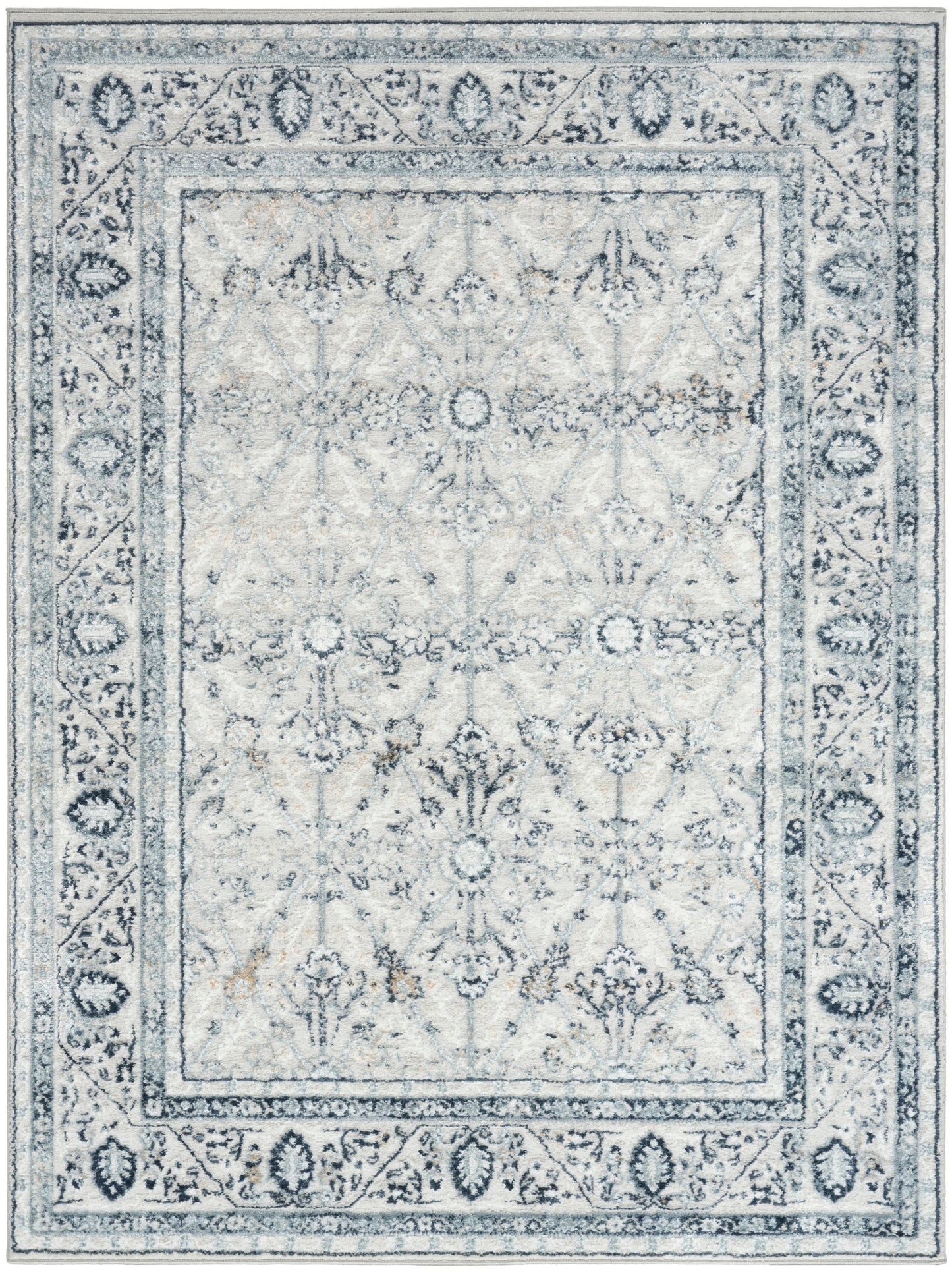 Rectangular light blue-gray distressed oriental rug with floral medallion pattern and decorative borders.