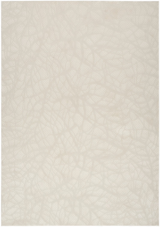 Cream beige rug with a subtle irregular pattern and a soft matte finish.