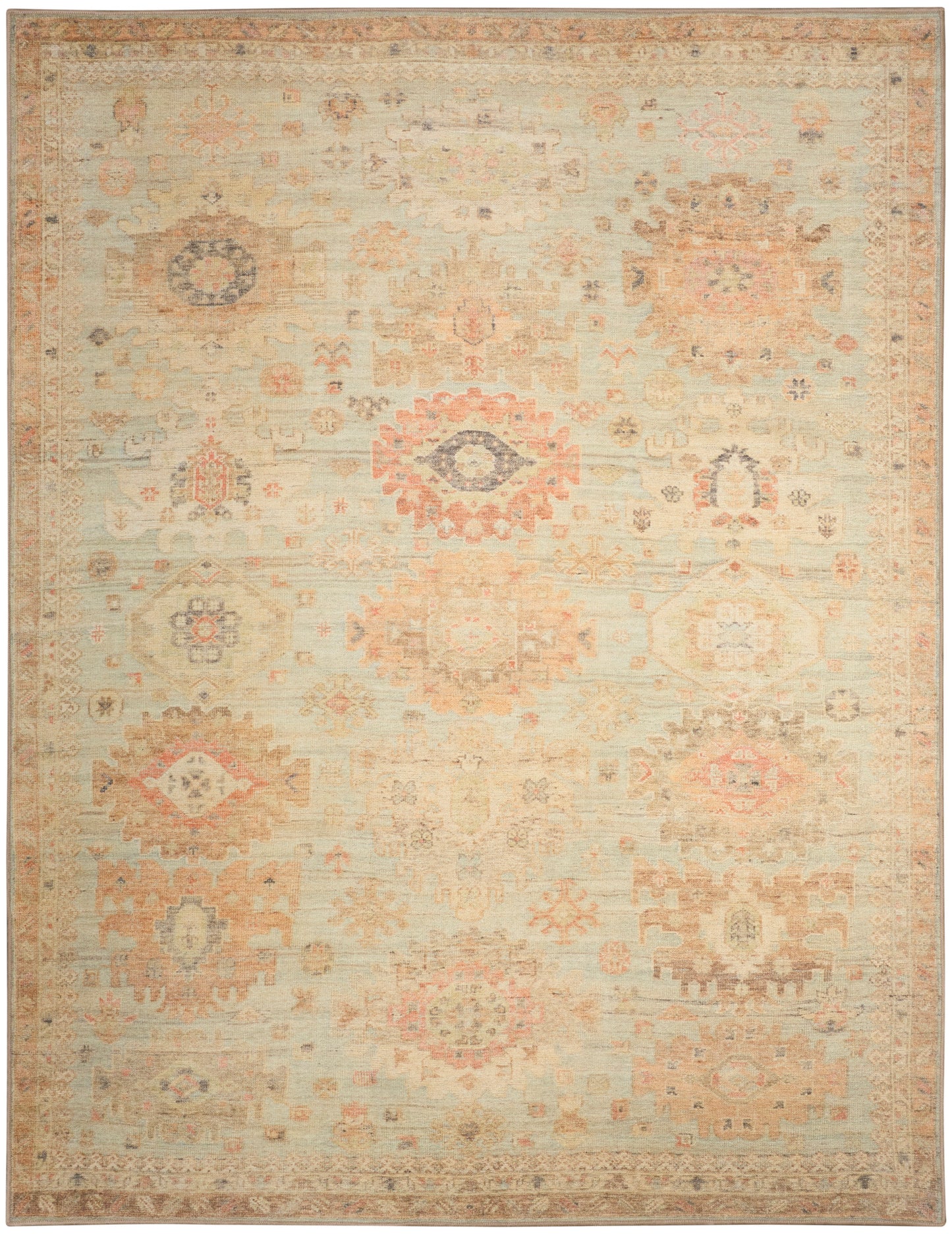 Distressed cream oriental rug with faded peach, blue and tan geometric floral medallions; vintage kilim-inspired design.