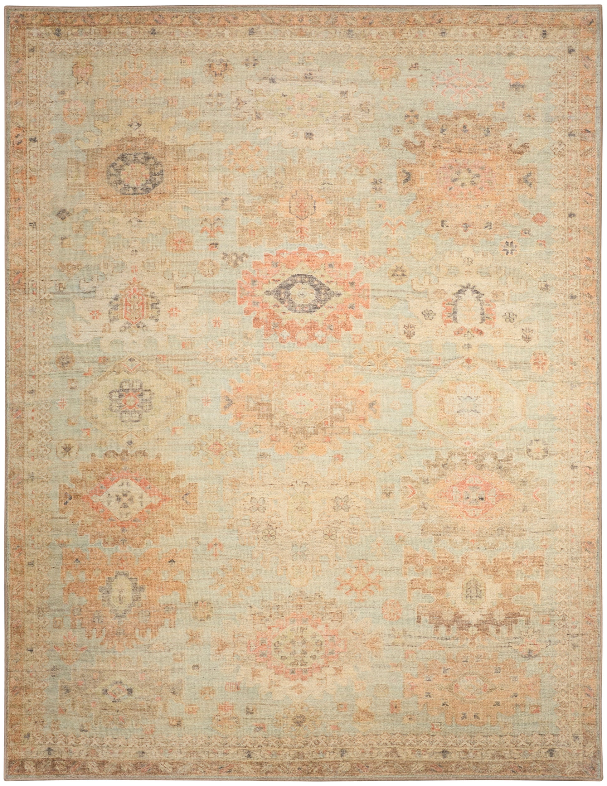 Distressed cream oriental rug with faded peach, blue and tan geometric floral medallions; vintage kilim-inspired design.
