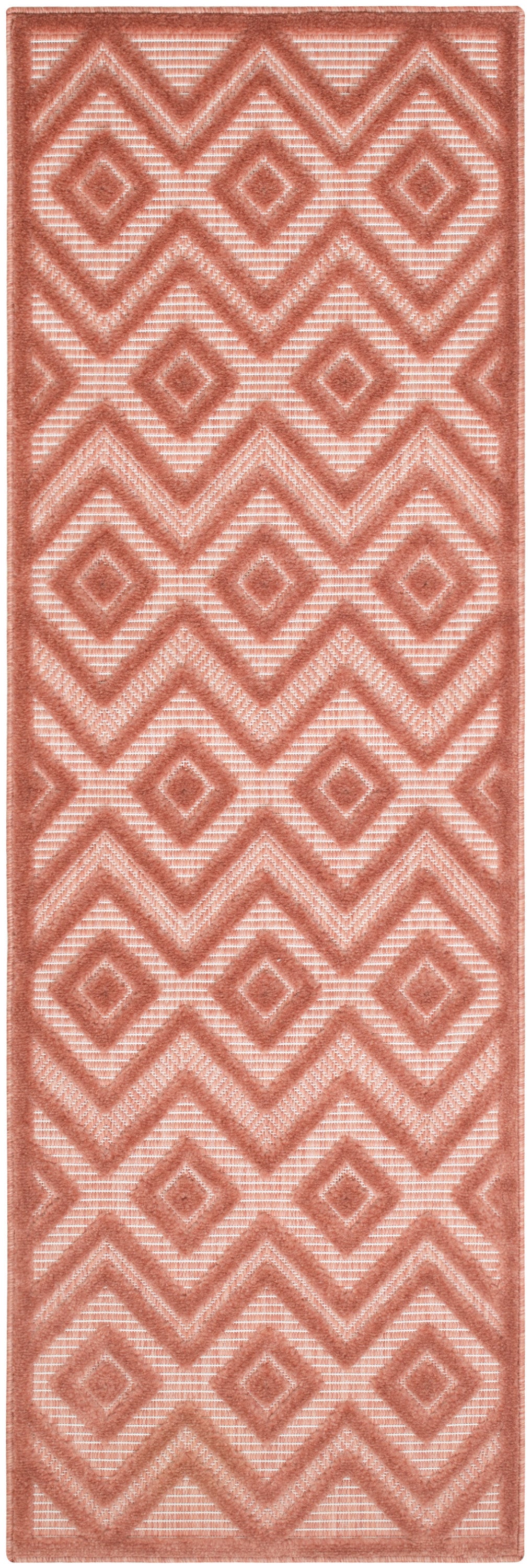 Terracotta pink geometric runner rug with diamond and chevron motifs, textured raised pile.