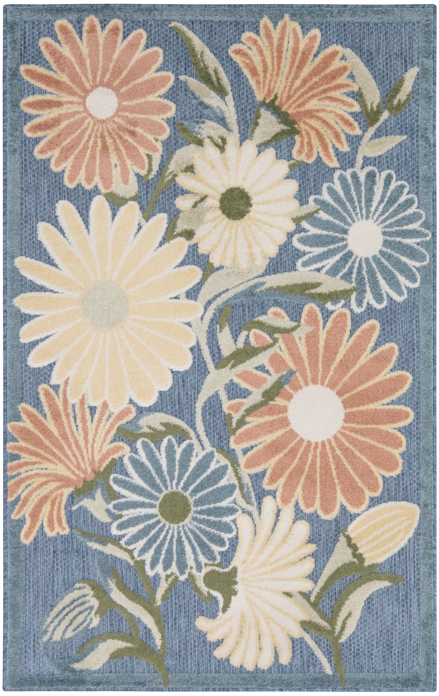 Area rug with large pastel daisies on a denim-blue background; peach, cream, yellow, and blue petals with green stems.