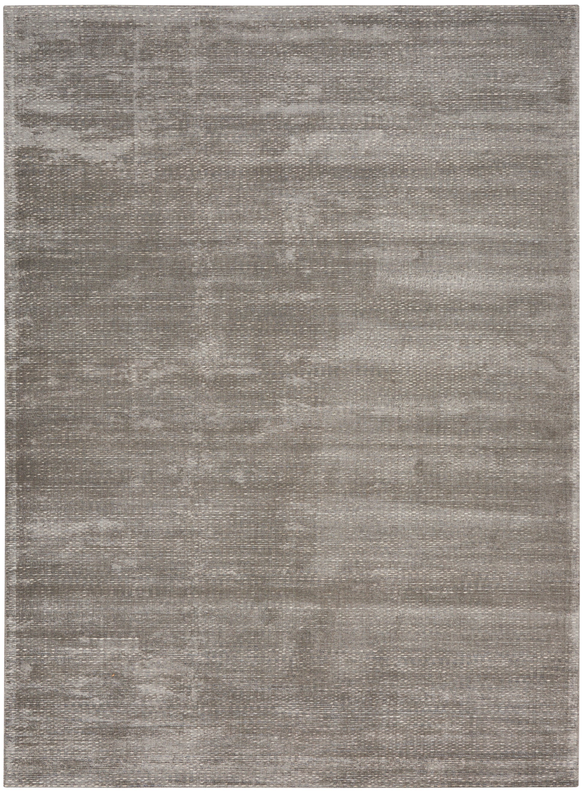 Gray rectangular rug with a subtle distressed texture and soft, muted tones; contemporary, versatile decor.