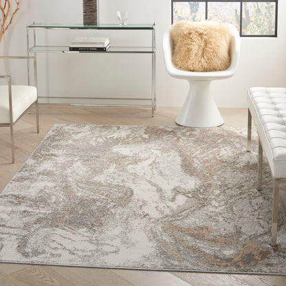 Modern living room with abstract beige-gray rug, glass chrome console table, white curved chair with fluffy beige cushion.