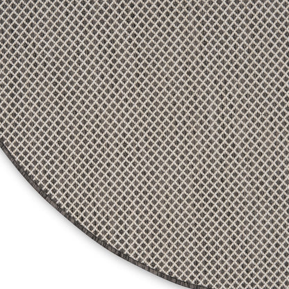 Round rug with small beige lattice pattern on taupe, woven texture; modern geometric accent for living rooms.