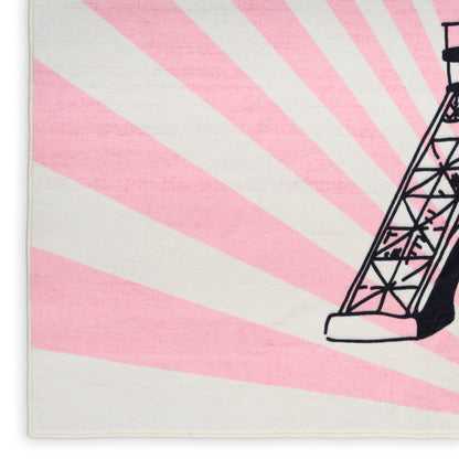 Pastel pink sunburst wall art featuring a black Eiffel Tower lattice silhouette.