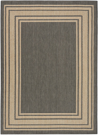 Rectangular flatwoven rug with charcoal center and beige layered rectangular borders; modern geometric living room decor.