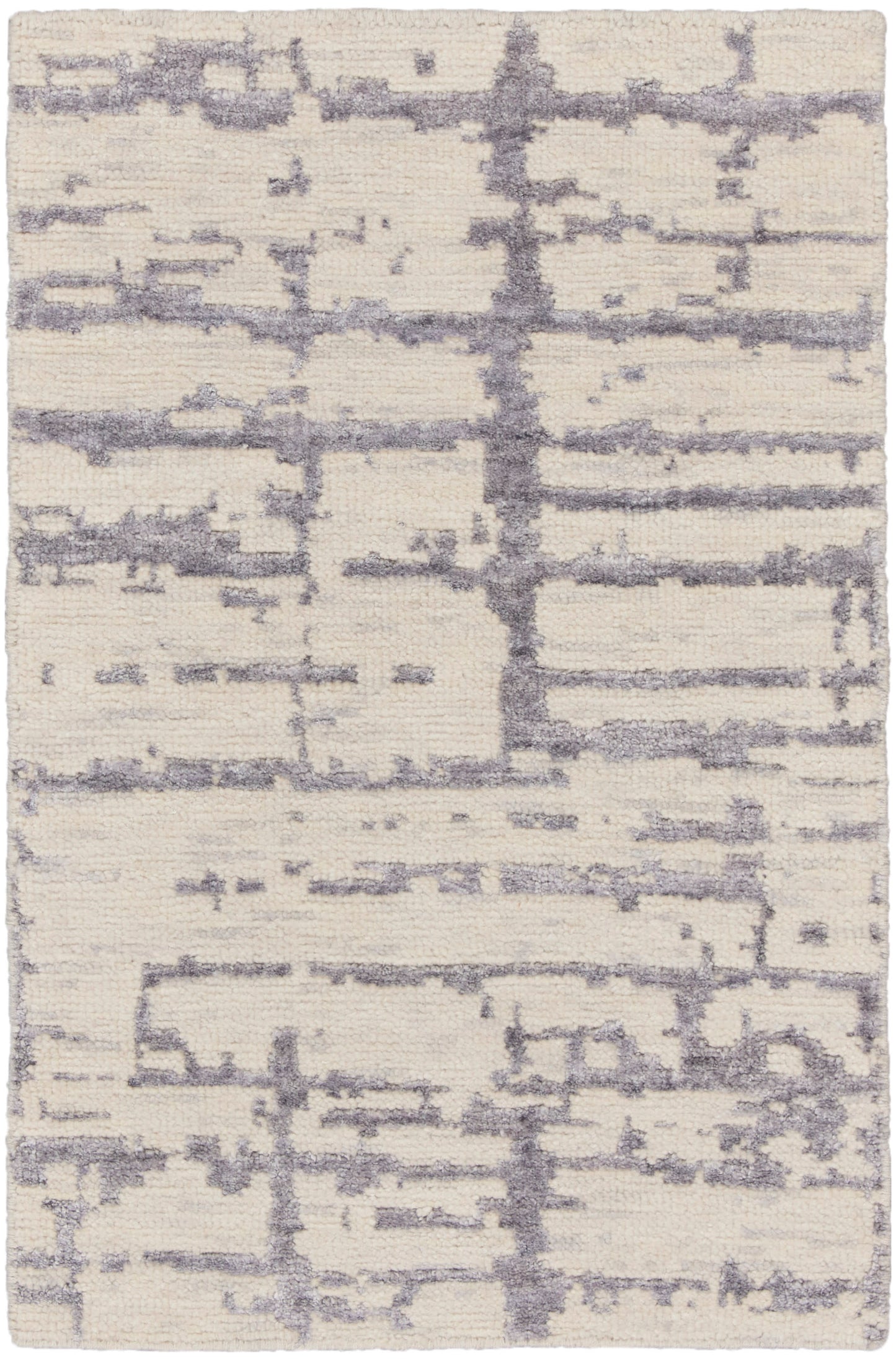 Cream shag rug with lavender-gray abstract lines and plush texture.