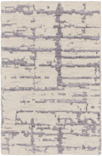 Cream shag rug with lavender-gray abstract lines and plush texture.