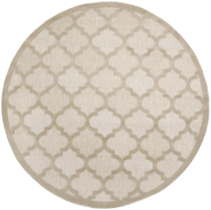 Round cream rug with taupe trellis quatrefoil pattern and soft texture.