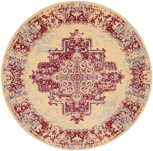 Round distressed beige area rug with red geometric medallion and pale blue-gray accents.