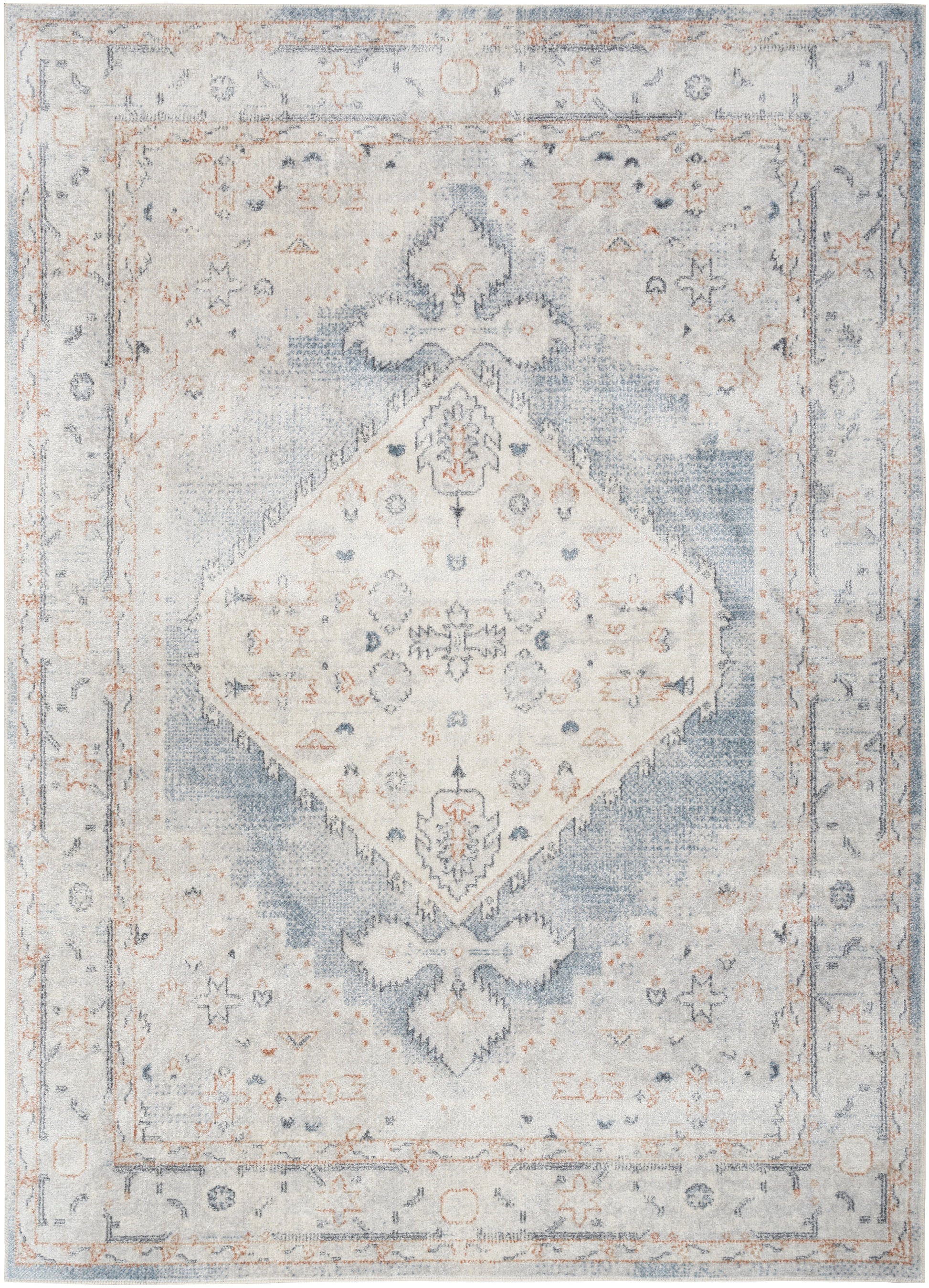 Vintage distressed area rug in pale blue and ivory with a central diamond medallion and ornate floral border