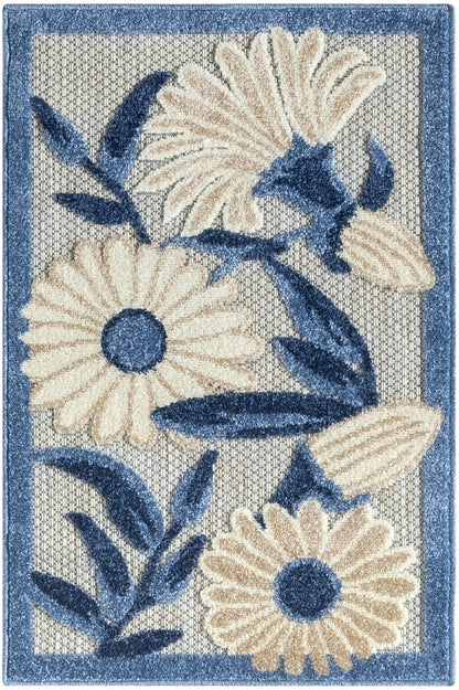 Rectangular rug with blue border, cream daisies and dark blue leaves in a textured beige weave.