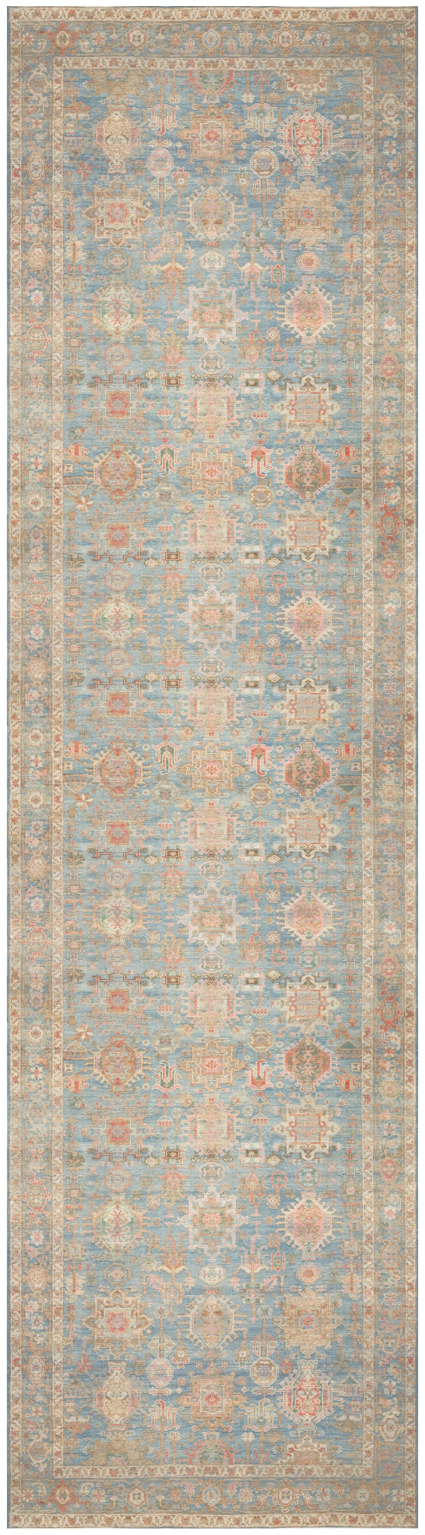 Pastel blue and peach vintage-inspired Persian-style runner rug with ivory motifs and decorative border.
