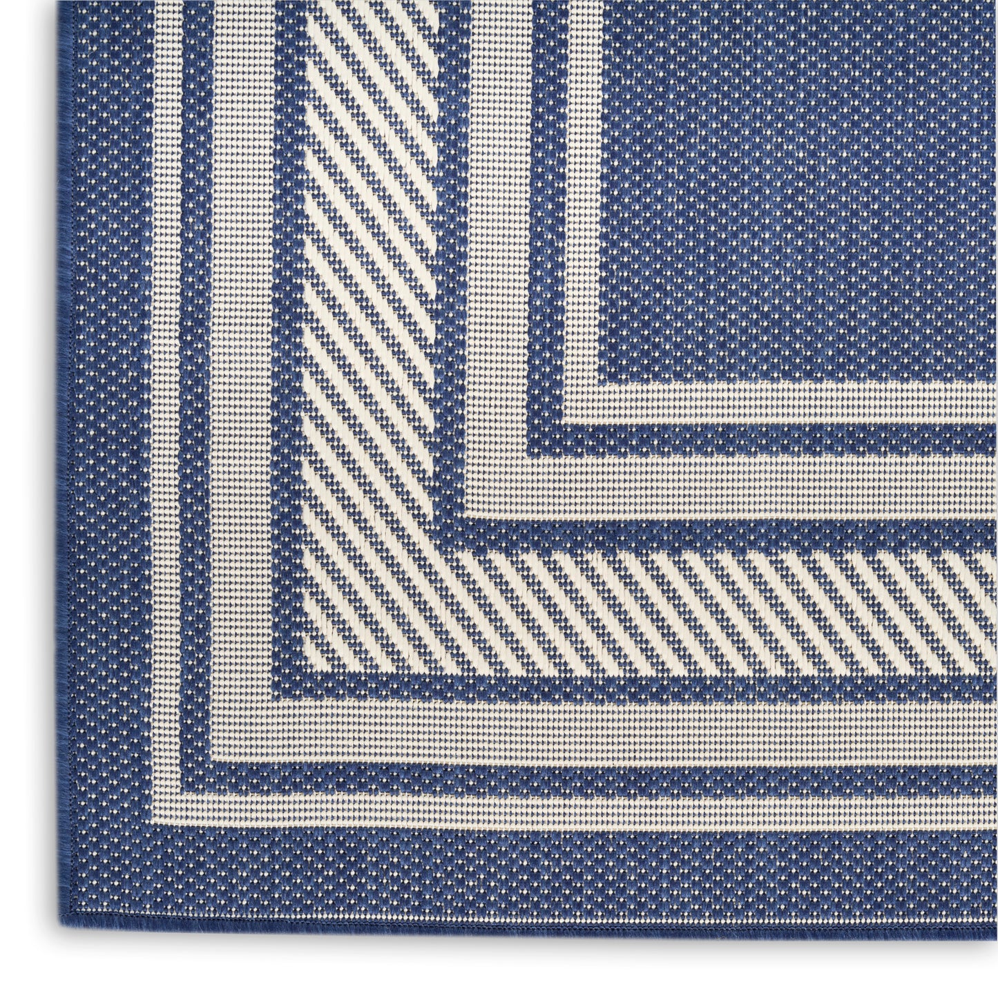 Blue and white woven textile with concentric square borders in a geometric rug runner pattern.