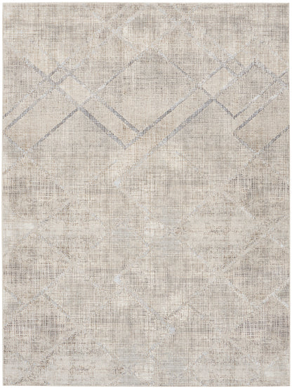 Neutral beige geometric area rug with faded diamond lattice pattern and distressed woven texture.