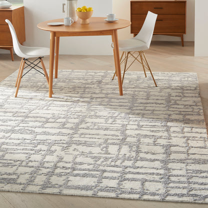 Gray geometric rug in a modern style, 8' x 10'.