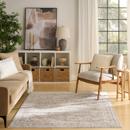 Neutral living room with beige sofa, wooden lounge chair, light rug, woven baskets, abstract art, greenery, by a window.