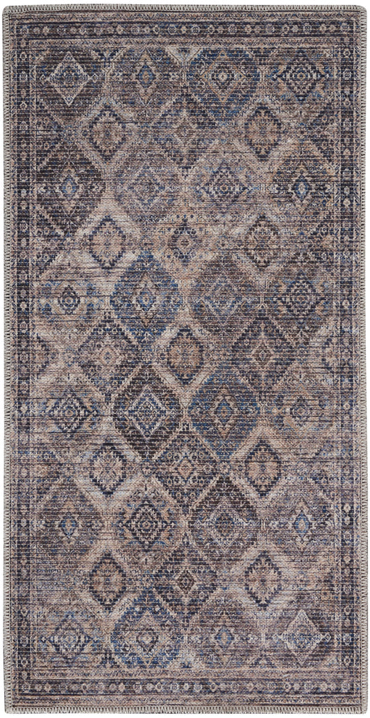 Blue and taupe distressed rug with geometric diamond motifs and fringed ends in a Persian-inspired vintage style.