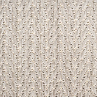 Cream rug with chevron zigzag pattern and dotted texture; soft neutral modern 8' x 10' area rug.