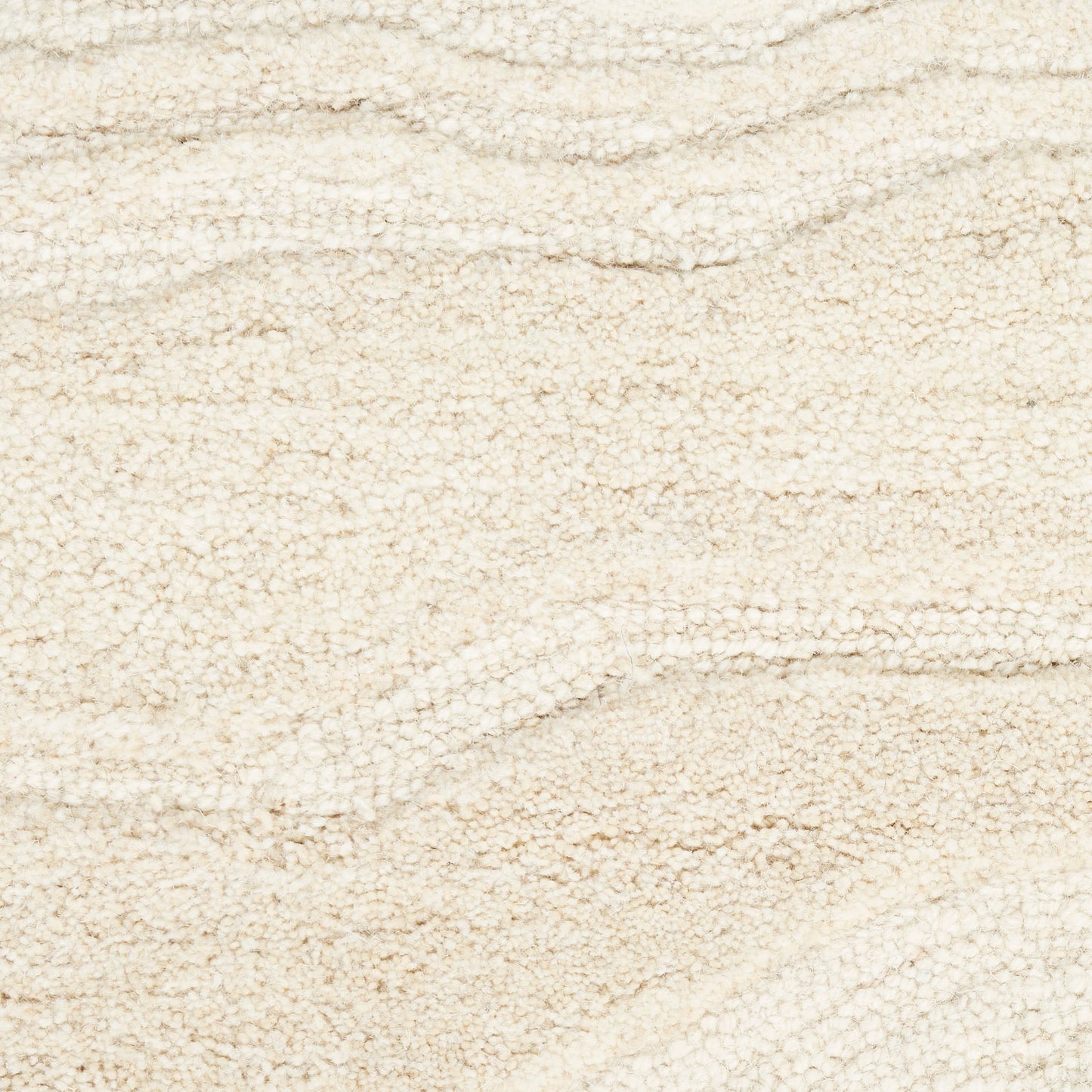 Cream beige terry cloth fabric with looped texture and subtle wave patterns; plush, towel-like material.