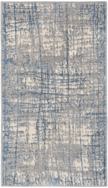 Rectangular area rug with blue and beige abstract distressed pattern; plush woven texture for modern living rooms.