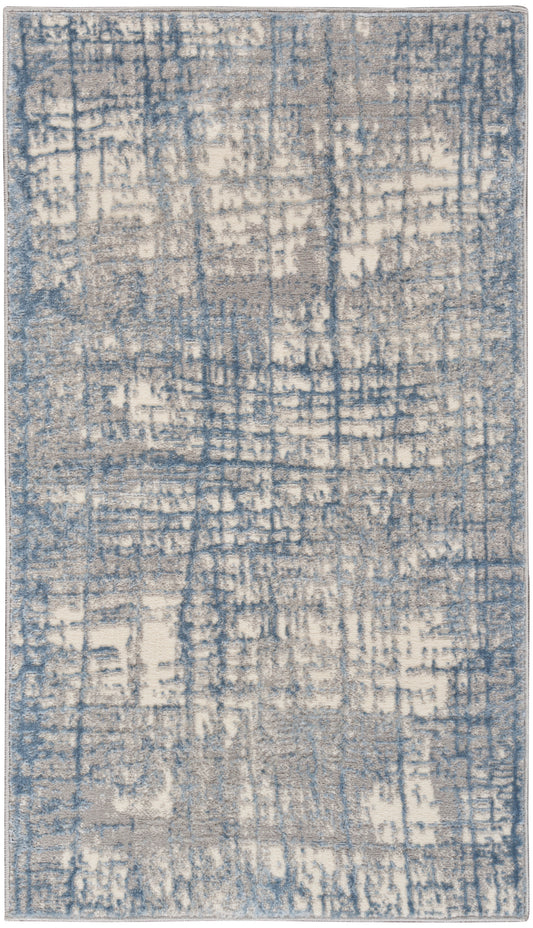 Rectangular area rug with blue and beige abstract distressed pattern; plush woven texture for modern living rooms.