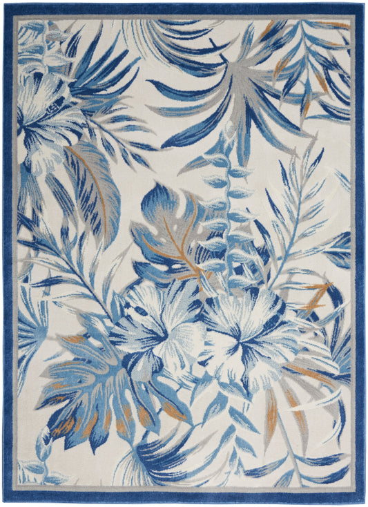 Blue tropical floral area rug with hibiscus and palm leaves on a white background, framed by a dark blue border.