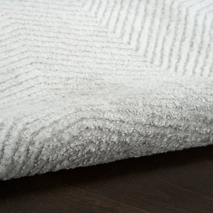 Vintage-style rug, 5' x 7', light-colored with subtle pattern.