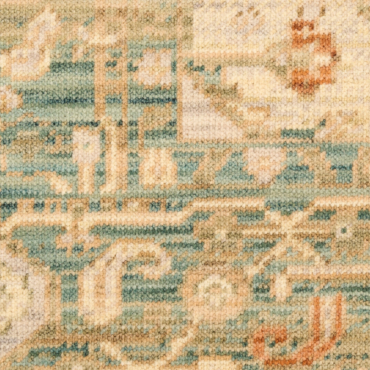 Woven area rug with teal, cream and blue geometric motifs in a vintage tapestry style.