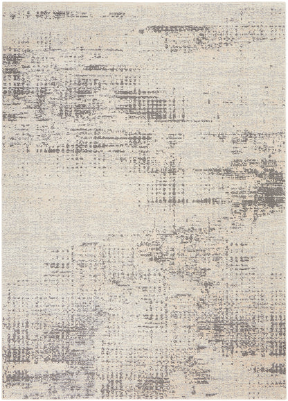 Rectangular cream and gray abstract distressed pattern area rug, contemporary style.