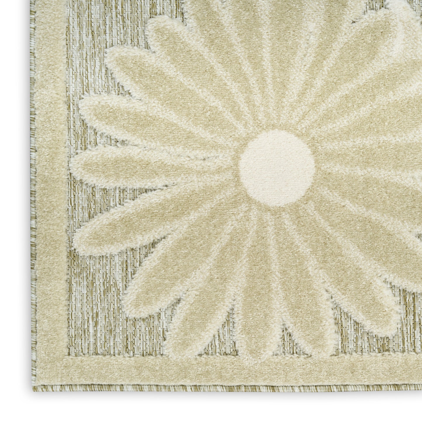 Cream rug with a large daisy motif, textured loop pile and beige border.