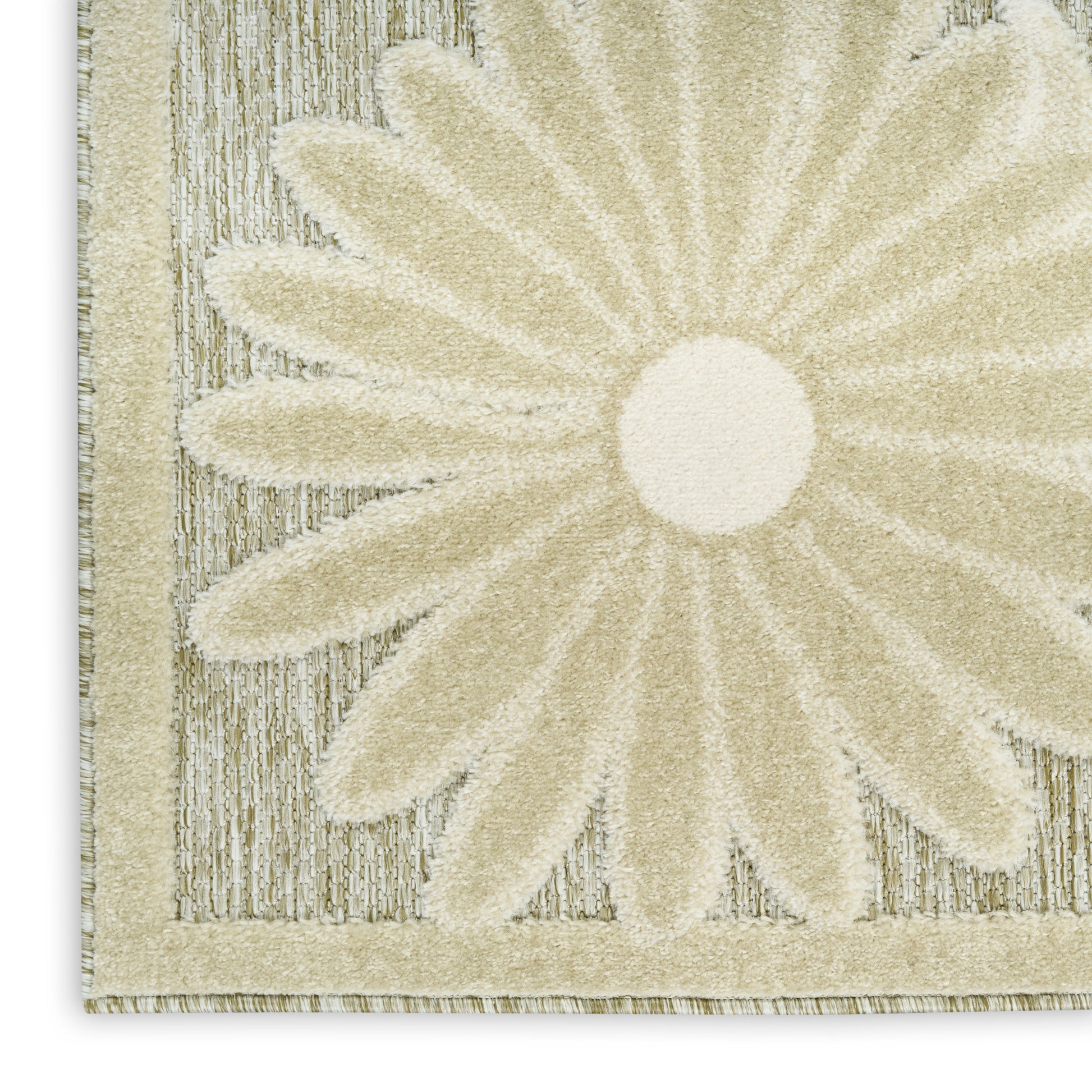 Cream rug with a large daisy motif, textured loop pile and beige border.